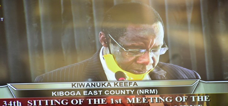 Hon. Keefa Kiwanuka, Chairperson, Committee on Environment and Natural Resources presenting his report to the House